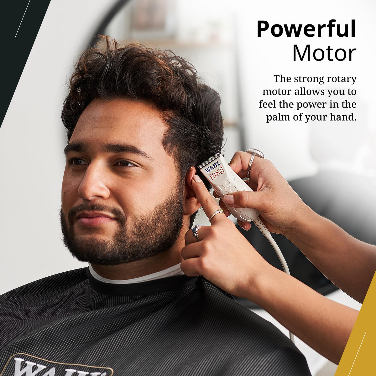 Wahl Peanut held in hand to show scale and comfortable one-handed trimming advantage