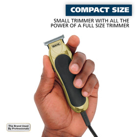 Wahl T‑Pro held in hand to show compact size and ergonomic control for detailing