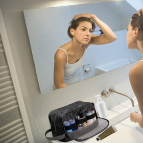 WANDF toiletry bag hanging on bathroom rail for hands-free access