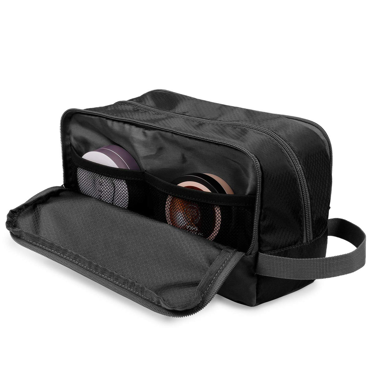 WANDF toiletry bag next to toothpaste showing scale and space-saving advantage