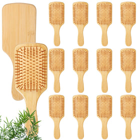 Wanmu bamboo brush front view showing paddle design and natural finish for smooth detangling