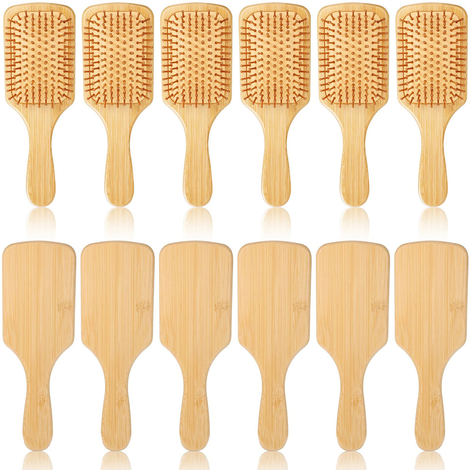 Wanmu bamboo paddle brush front view showing natural wood finish and wide coverage benefit