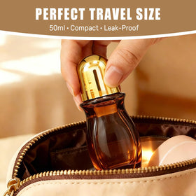 Warmify bottle held in hand showing 50ml scale and easy portability