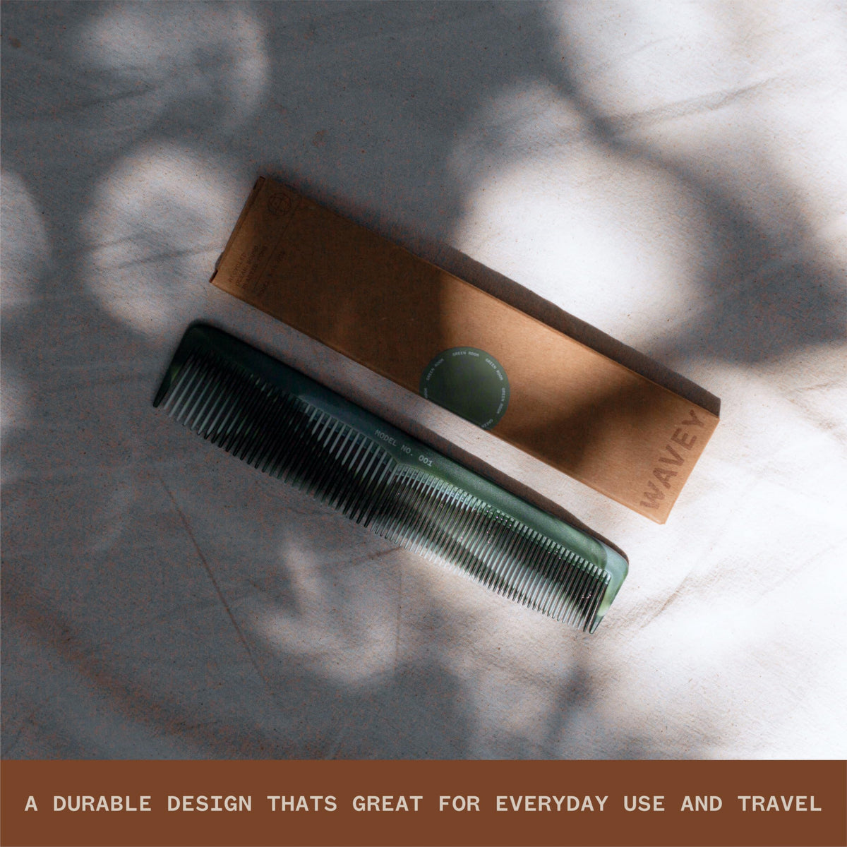 WAVEY comb held in hand to show 7-inch scale and travel-friendly design