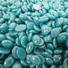 Hand holding Waxness 1 kg tub to show scale and professional quantity benefit