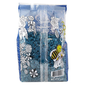 Professional waxing underarm using Waxness azulene beads highlighting gentle removal benefit