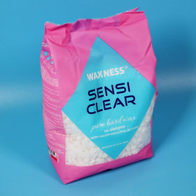 1kg bag of Waxness Sensi Clear next to measuring tools showing salon-ready quantity benefit