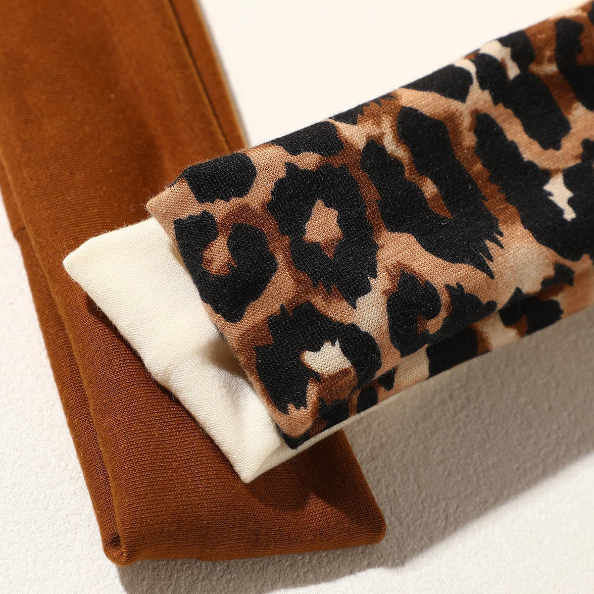 Weazppre hand holding headband shows size and portability for on-the-go convenience