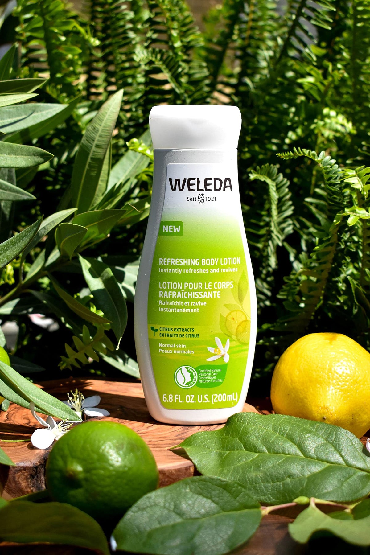 Weleda citrus lotion applied to forearm demonstrating soft, non-greasy finish