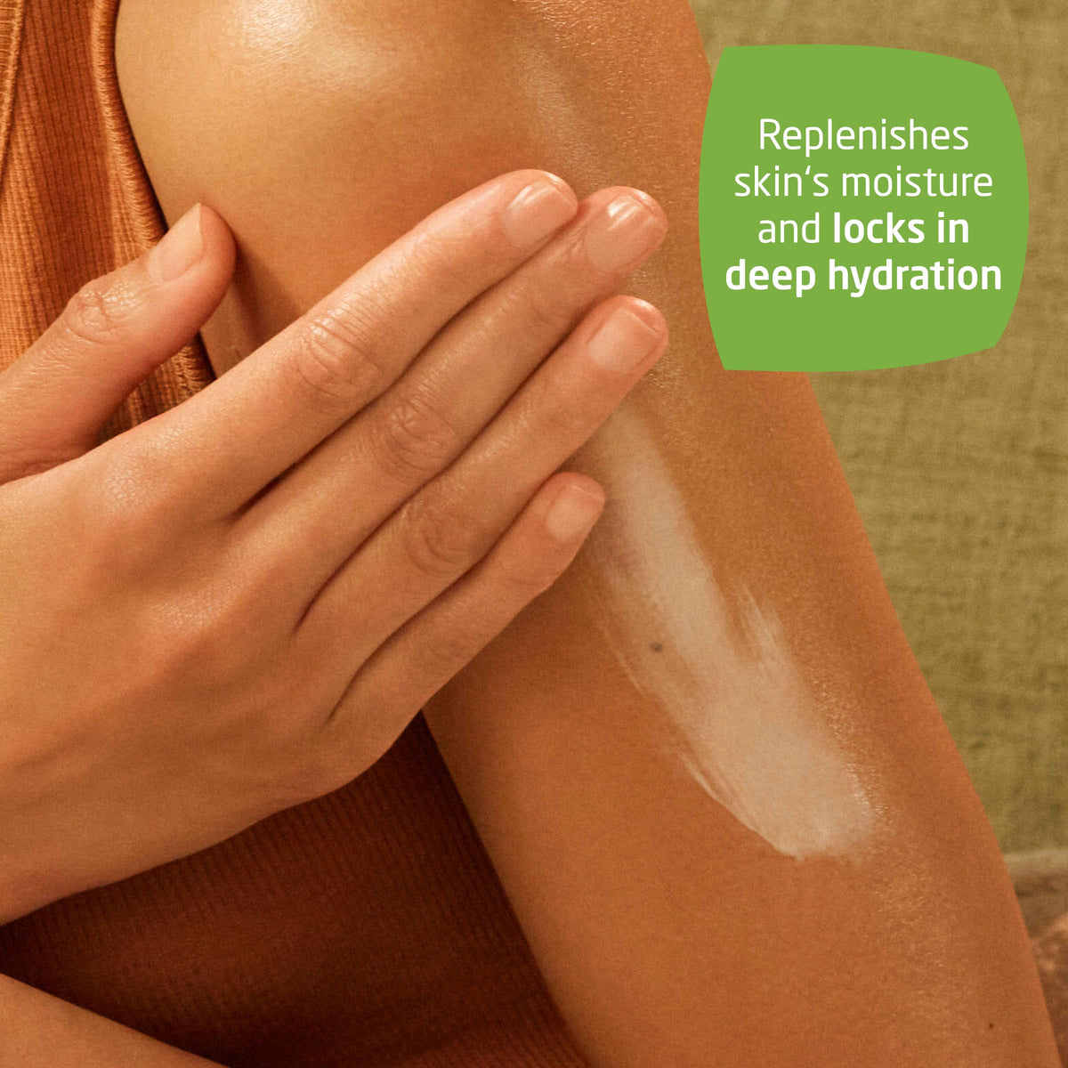 Weleda lotion texture on fingertip showing lightweight absorption