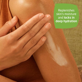 Weleda lotion texture on fingertip showing lightweight absorption