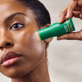 Weleda serum stick applied to hand demonstrating hydration and easy, precise coverage