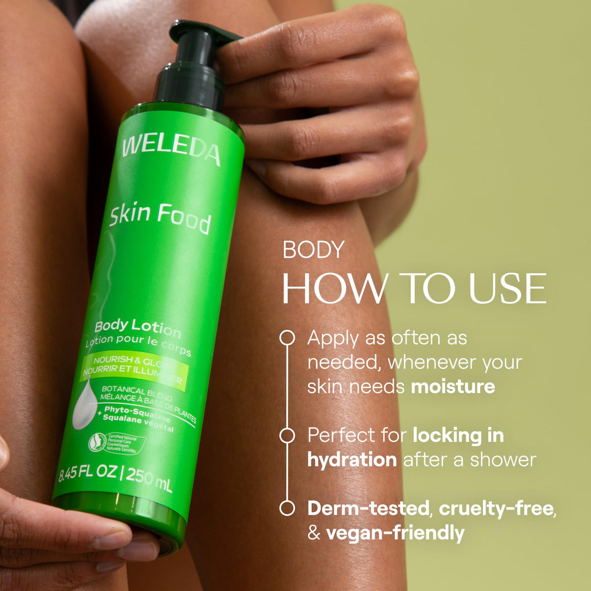 Weleda Skin Food body lotion beside a hand for scale demonstrating bottle size