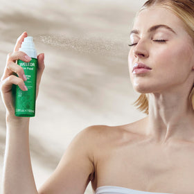 Weleda Skin Food held in hand to show travel-ready size and on-the-go hydration benefit