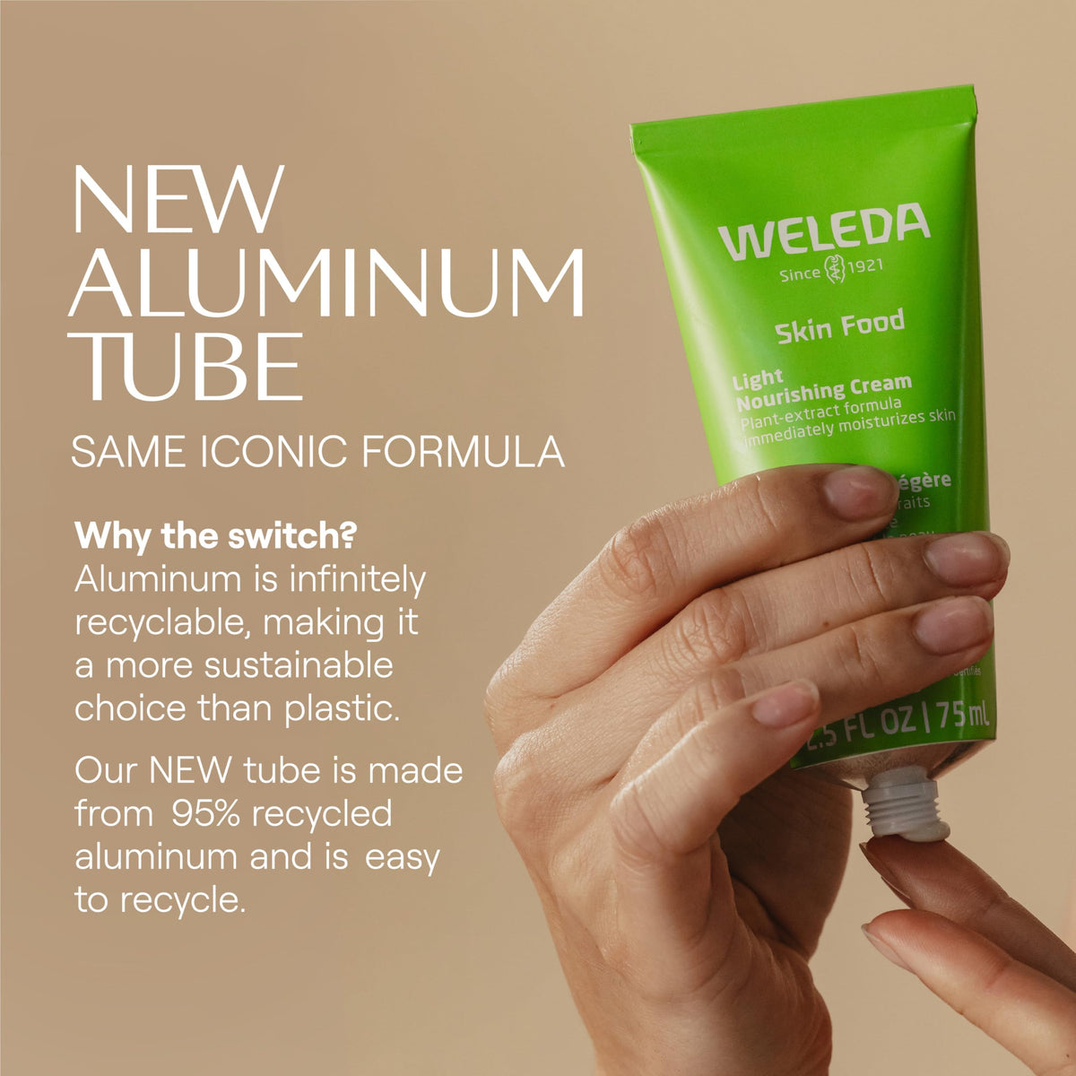 Hand holding Weleda Skin Food Light tube to show 2.5 fl oz scale and portability benefit