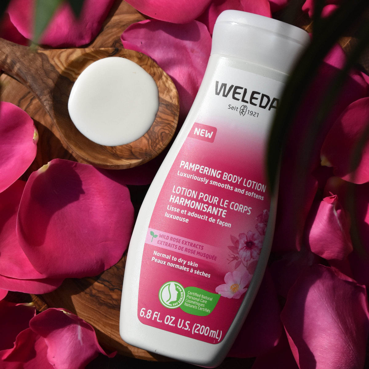 Weleda lotion texture close-up illustrating smooth spreadability and fast absorption benefit