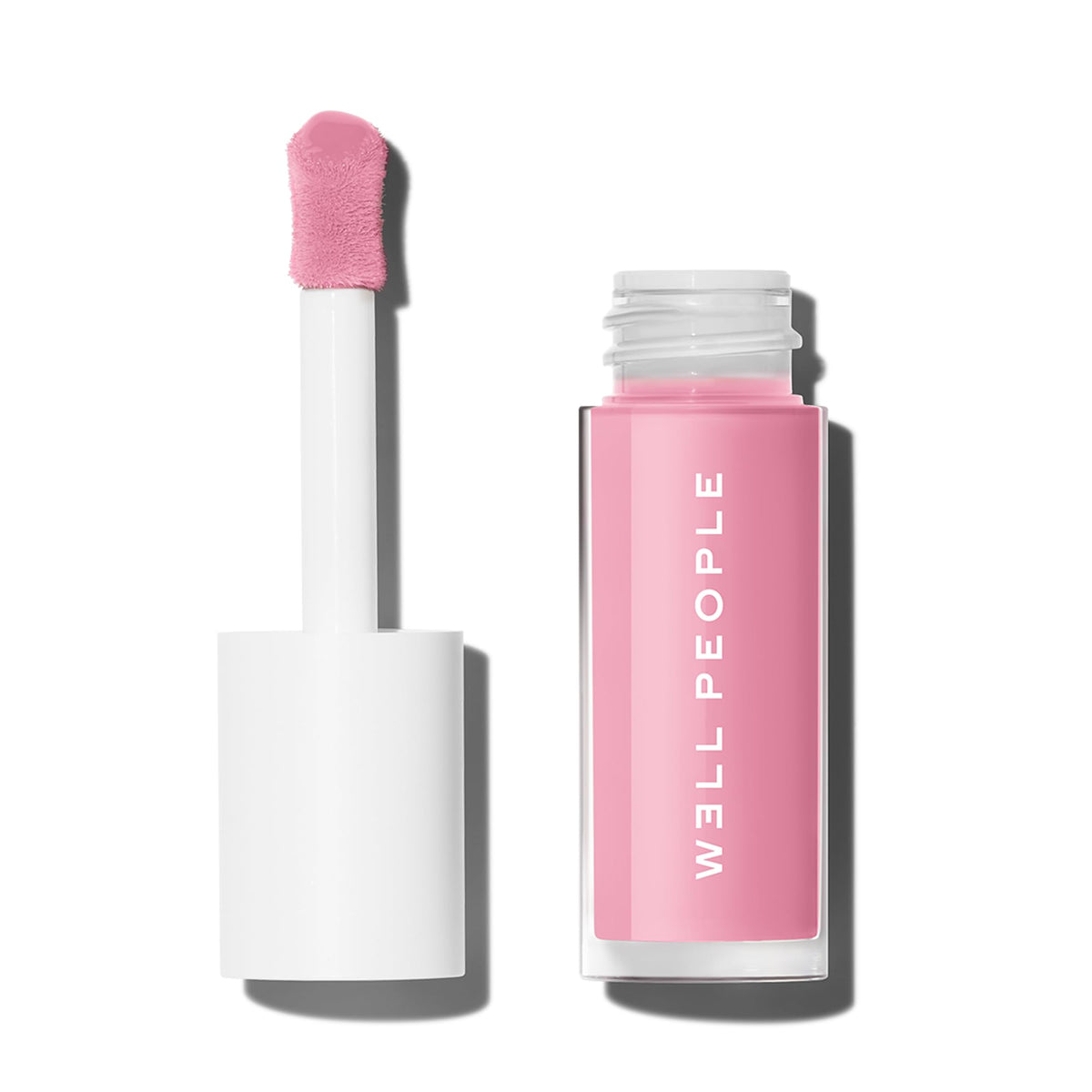 Well People lip tinted oil front packaging showing cherry blossom shade and glossy finish