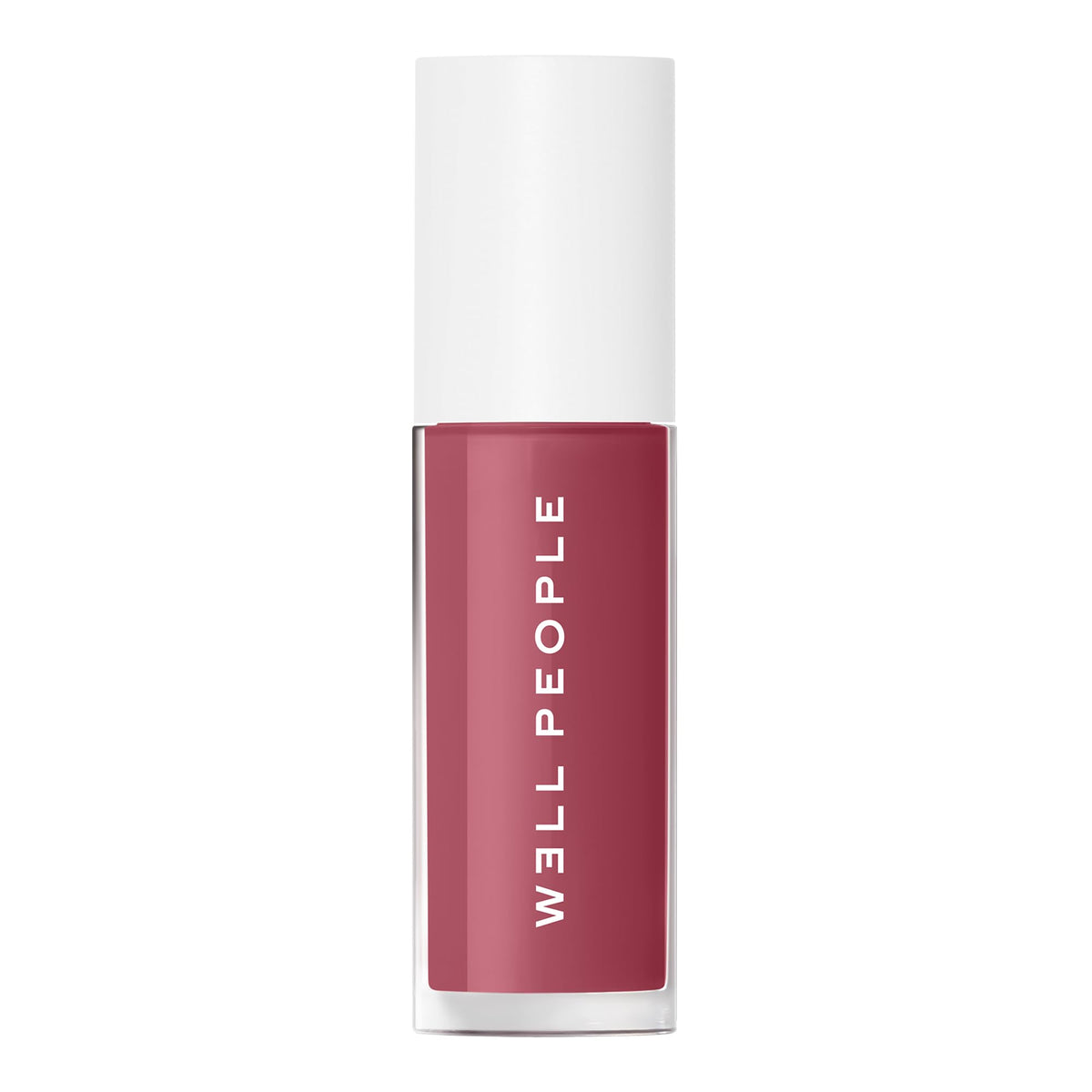 Well People lip oil worn in outdoor lifestyle scene for natural everyday glow