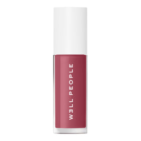 Well People lip oil worn in outdoor lifestyle scene for natural everyday glow