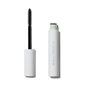 Well People mascara tube front showing sleek black packaging and product name benefit