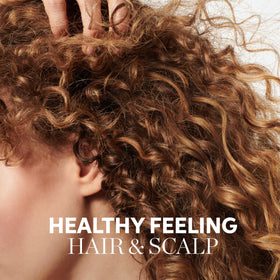 Wella Professionals creamy lather close-up showing rich foam and gentle cleansing