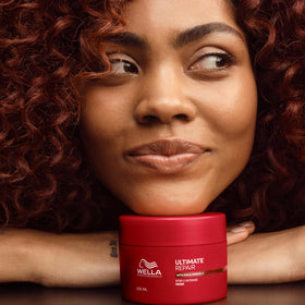 Wella Professionals mask used by stylist in salon to demonstrate professional results