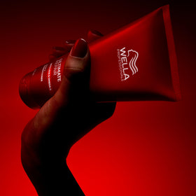 Wella Professionals size comparison in hand showing travel-friendly volume