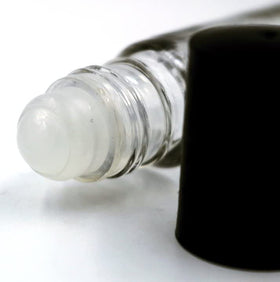 Well's Oil placed in a handbag showing portable daily refresh benefit