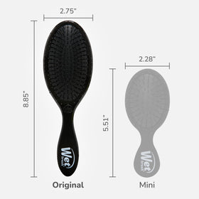Wet Brush gliding through wet hair to reduce pulling and tangles