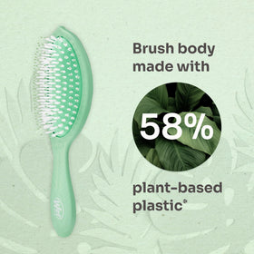 Wet Brush in use brushing dry hair to refresh and reduce frizz