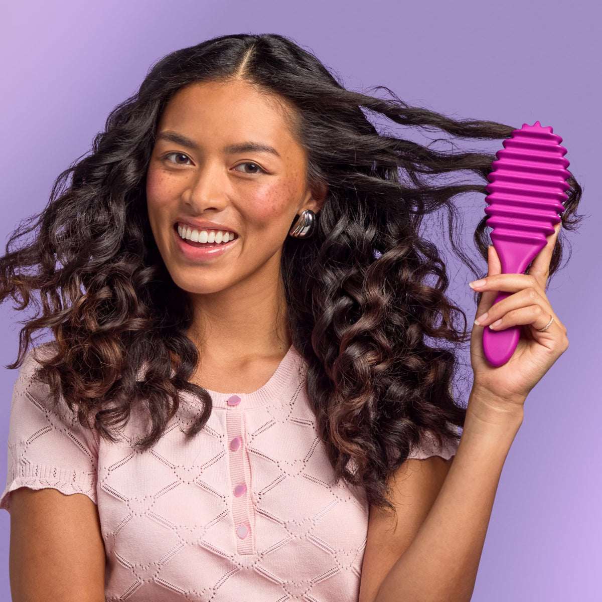 Wet Brush packed in a gym bag to show travel-ready curl refreshing convenience