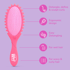 Wet Brush styling damp spiral curls to define clumps and reduce frizz