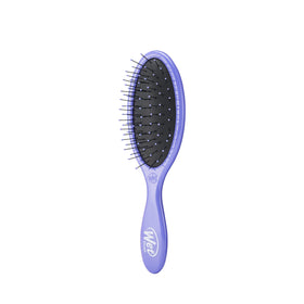 Wet Brush held in hand to show size and comfortable control for delicate hair