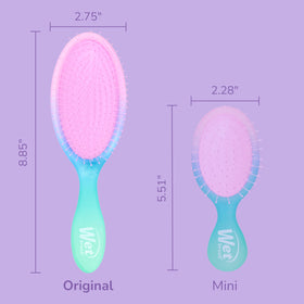 Wet Brush held in hand to show scale and easy maneuvering for everyday use