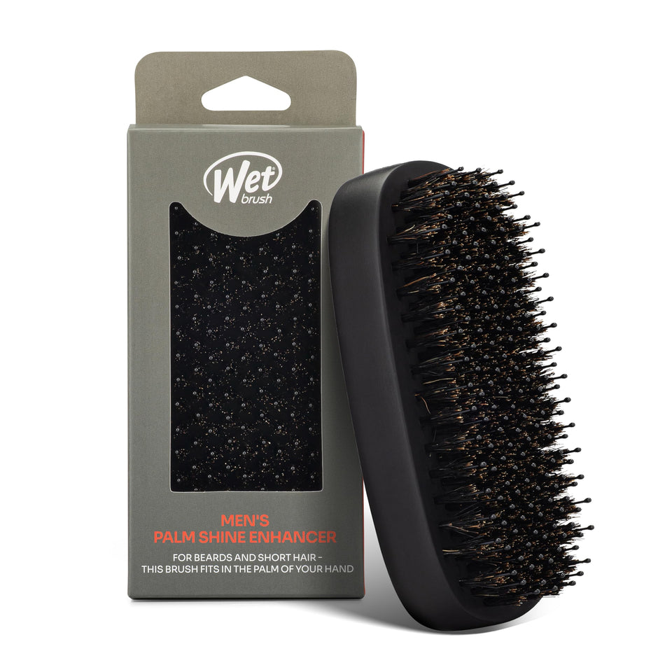 Wet Brush front view showing compact palm brush and black finish for easy styling
