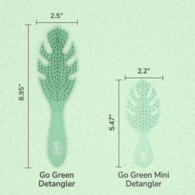 Wet Brush Go Green held in hand for scale showing compact size benefit