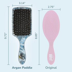Wet Brush held in hand detangling wet hair for gentle, pain-free strokes