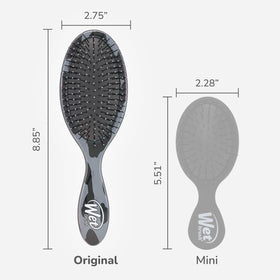 Wet Brush held in hand to show scale and portability, brand makes detangling easier