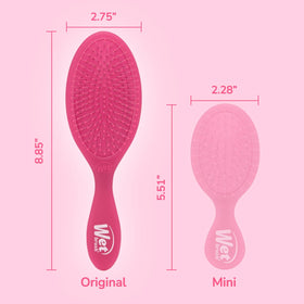 Wet Brush held in hand to show size and effortless control during brushing