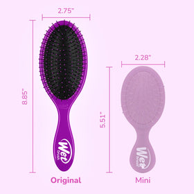 Wet Brush held in hand to show scale and comfortable control benefit