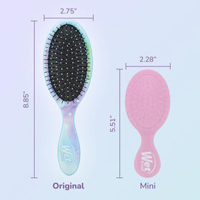 Wet Brush held in hand to show compact size and convenient portability for travel