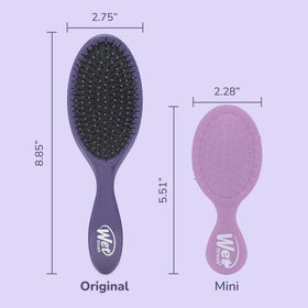 Wet Brush held in hand to show compact size and travel-friendly convenience