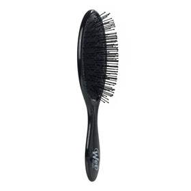 Wet Brush on bathroom counter styled with towel showing everyday salon-like results