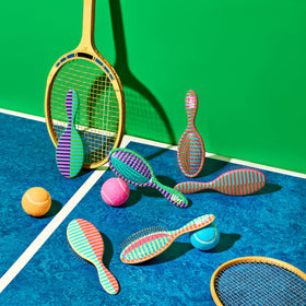 Wet Brush styled in a sporty bathroom setting to convey active, on-the-go lifestyle