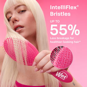 Wet Brush in use on wet hair demonstrating gentle detangling without pulling