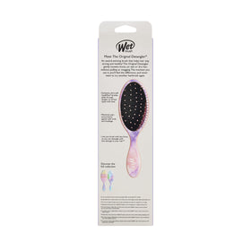Wet Brush smoothing wet hair after shampoo demonstrating easy knot removal