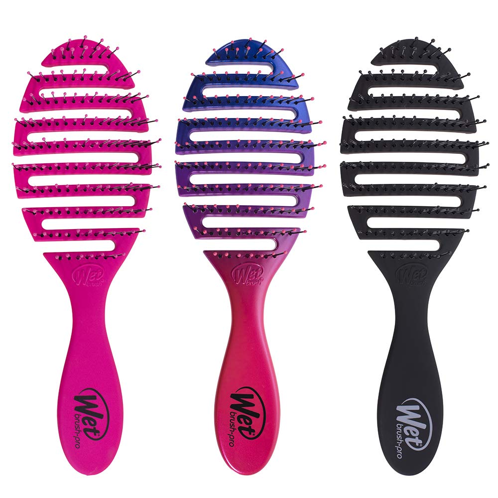 Wet Brush held in hand for scale showing compact size and easy travel benefit