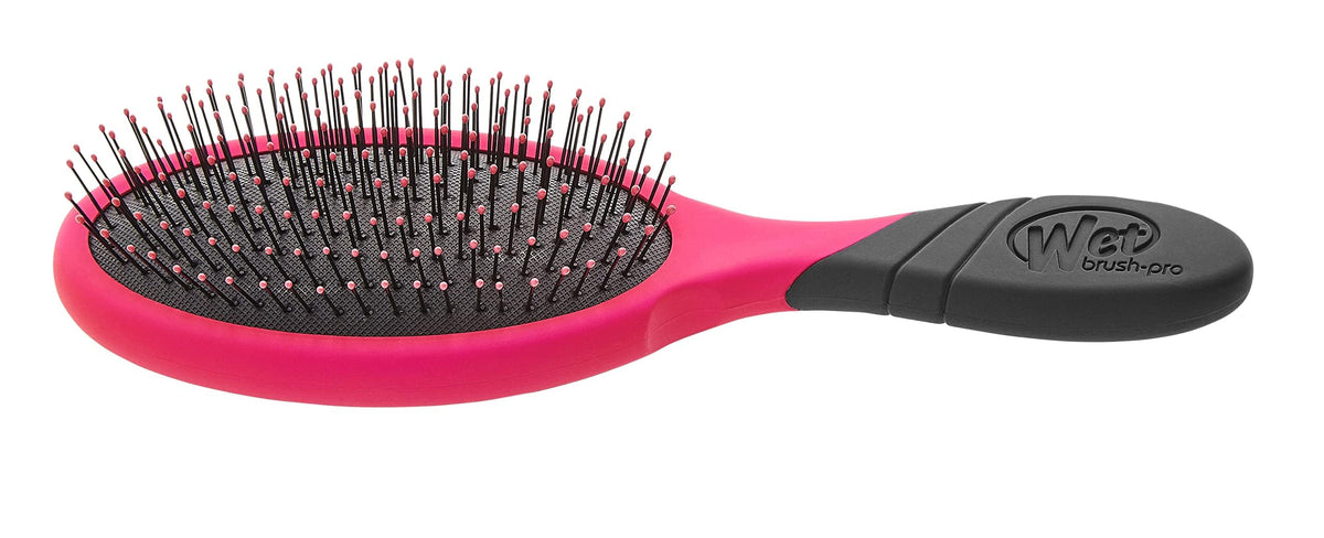 Wet Brush Pro HeatFlex bristles under a hair dryer showing safe heat styling use