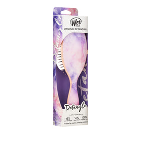Wet Brush shown in hand to show size and portability for travel convenience