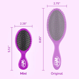 Wet Brush held in hand to show scale and easy travel convenience